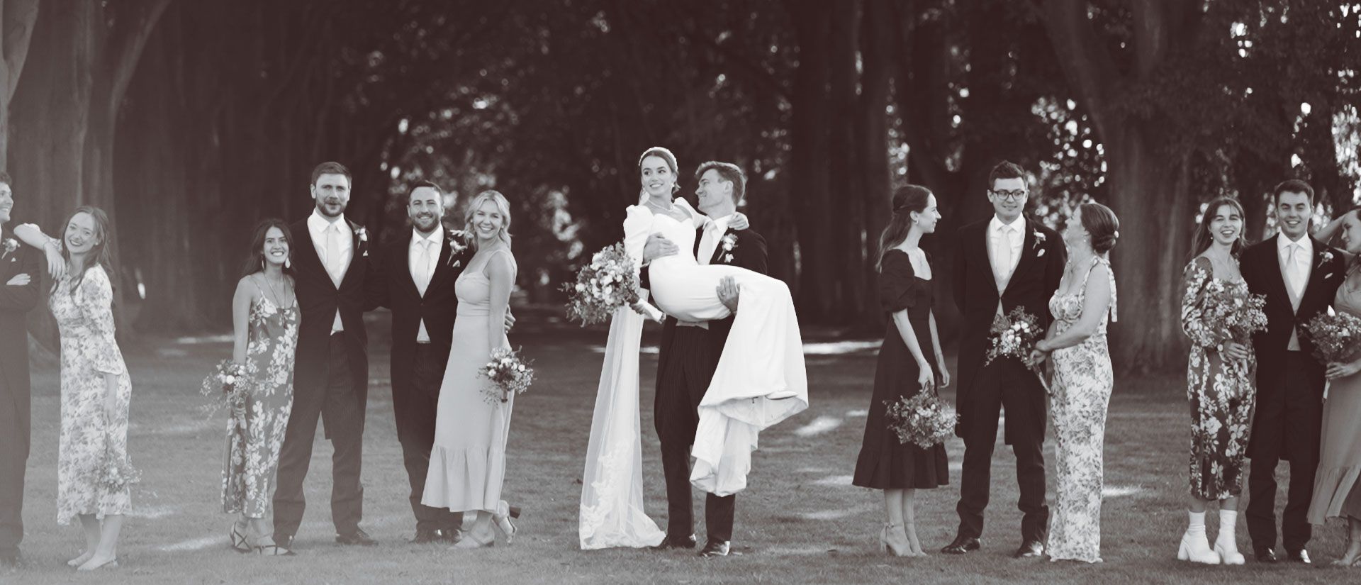 Groom Carries Bride at Lucknam Park Wedding